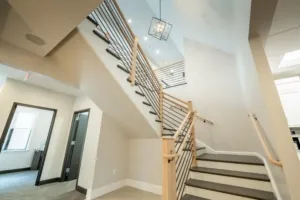 Office stairwell with wood steps and metal railings