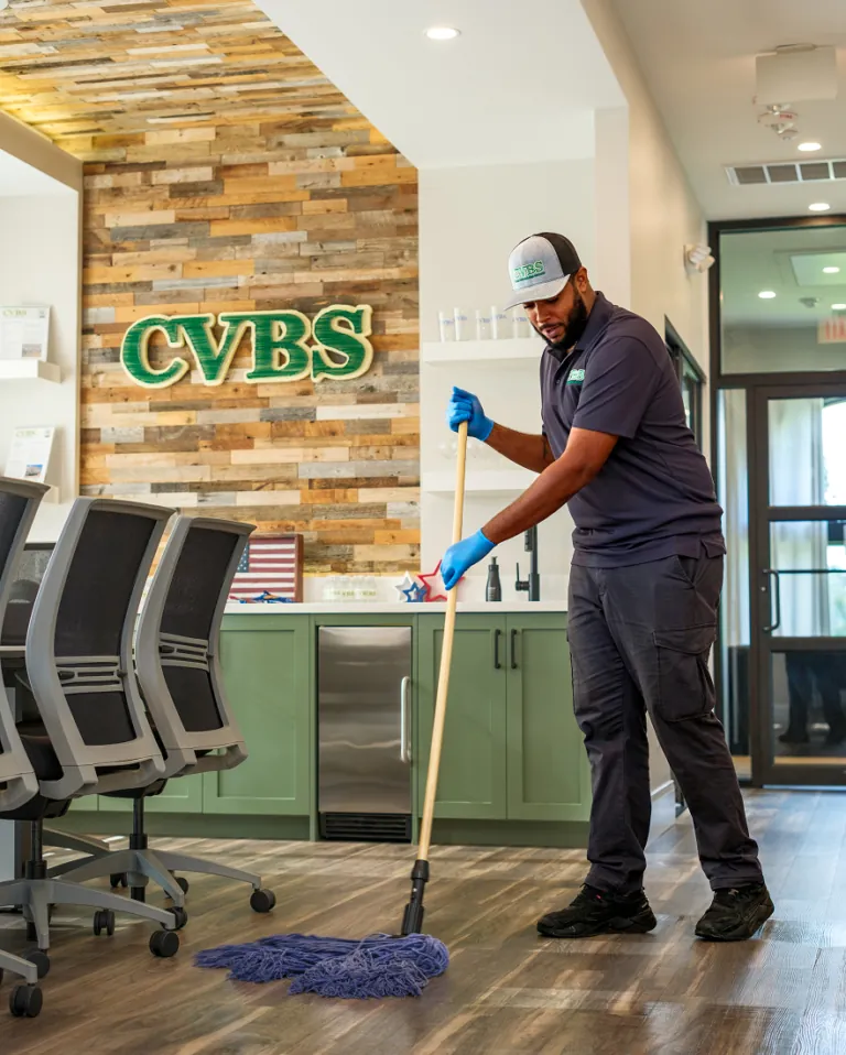 CVBS employee mopping a commercial lobby