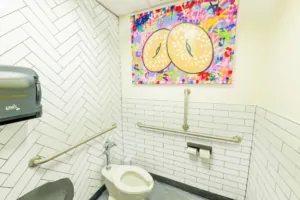 Professionally cleaned bathroom in a bagel shop with view of the toilet