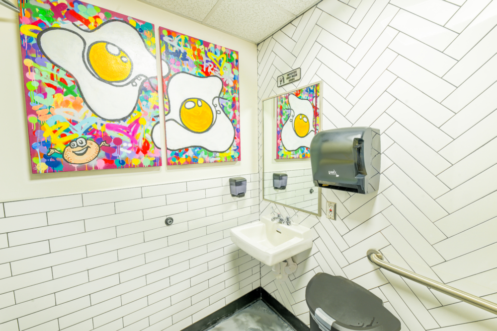 Professionally cleaned bathroom in a bagel shop with view of the sink