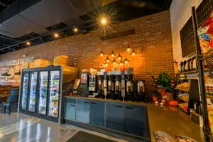 Professionally cleaned bagel shop with view of the coffee and condiment counter