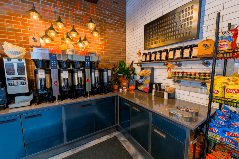 Professionally cleaned bagel shop with view of the coffee and condiment counter