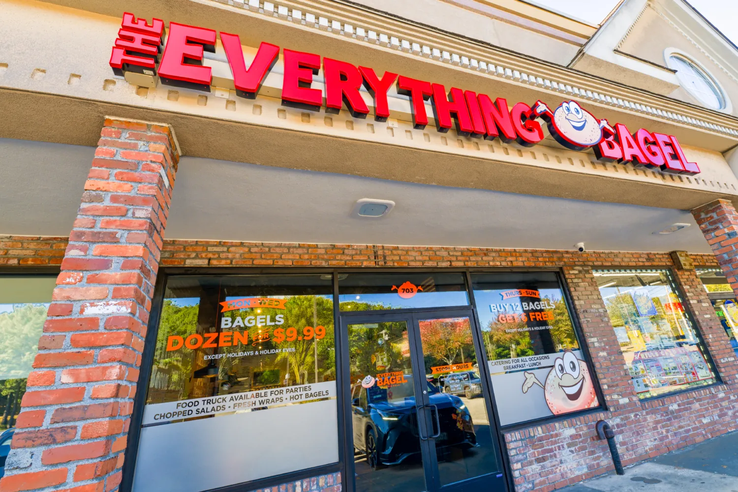 Professionally cleaned bagel shop outside area with view of the sign "Everything Bagel"