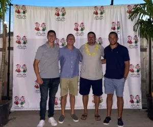 Four CVBS team members at the Little Saint Nick Foundation Summer Luau